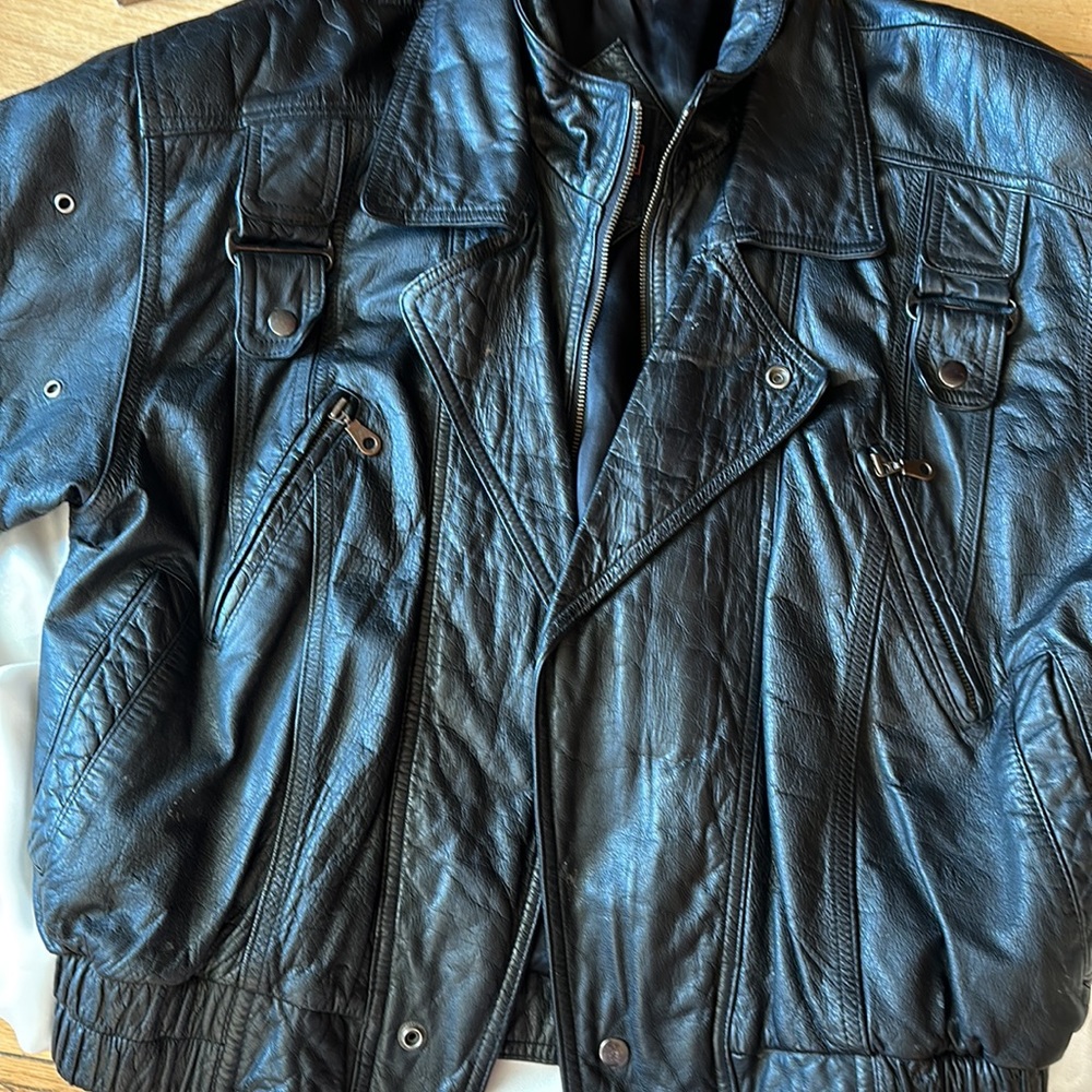 Woman’s Black Leather Jacket. Medium. Warm and heavy.  Ppl